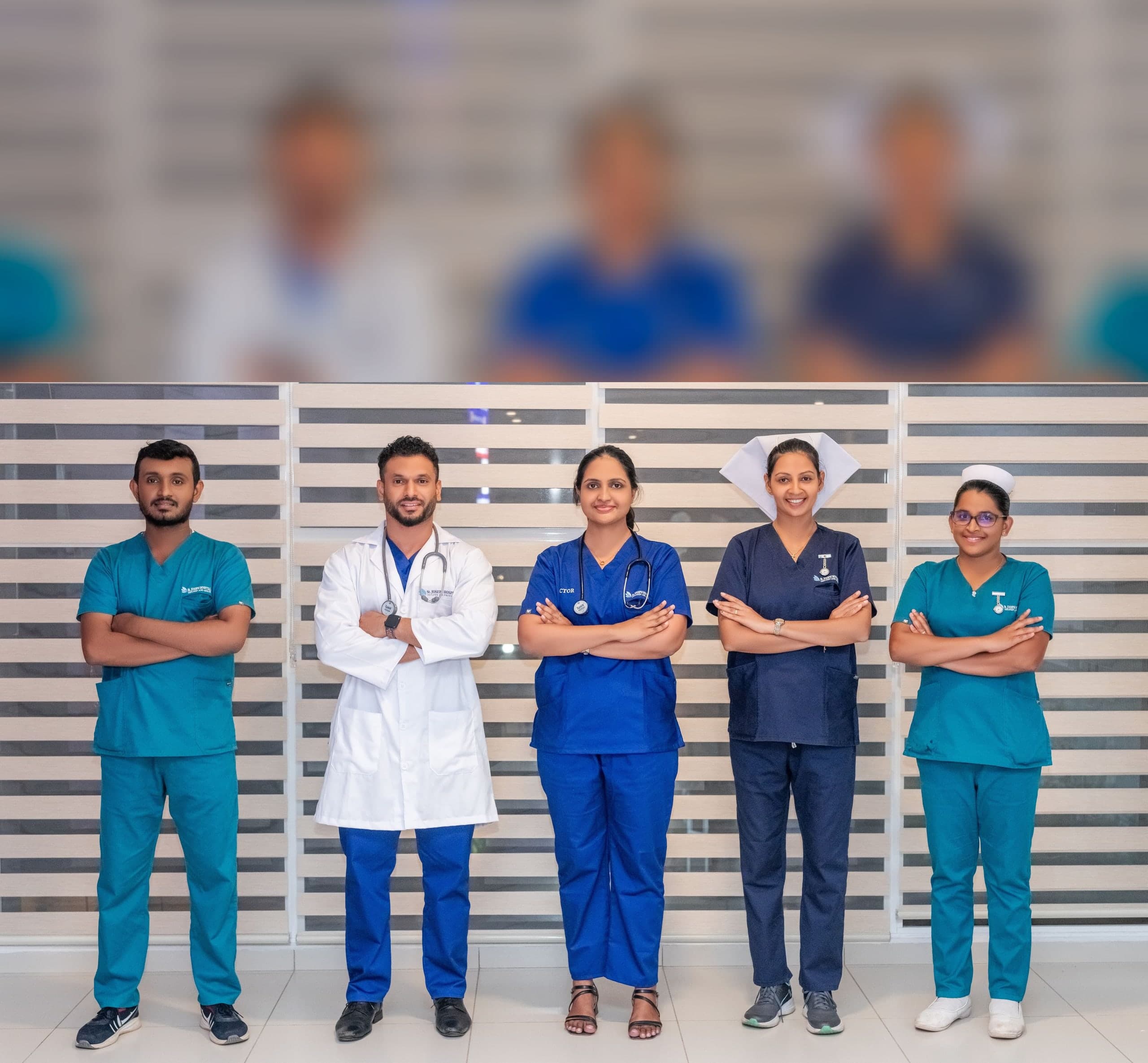 Five St. Joseph Hospital Negombo clinicians in branded scrubs and a white coat, standing together