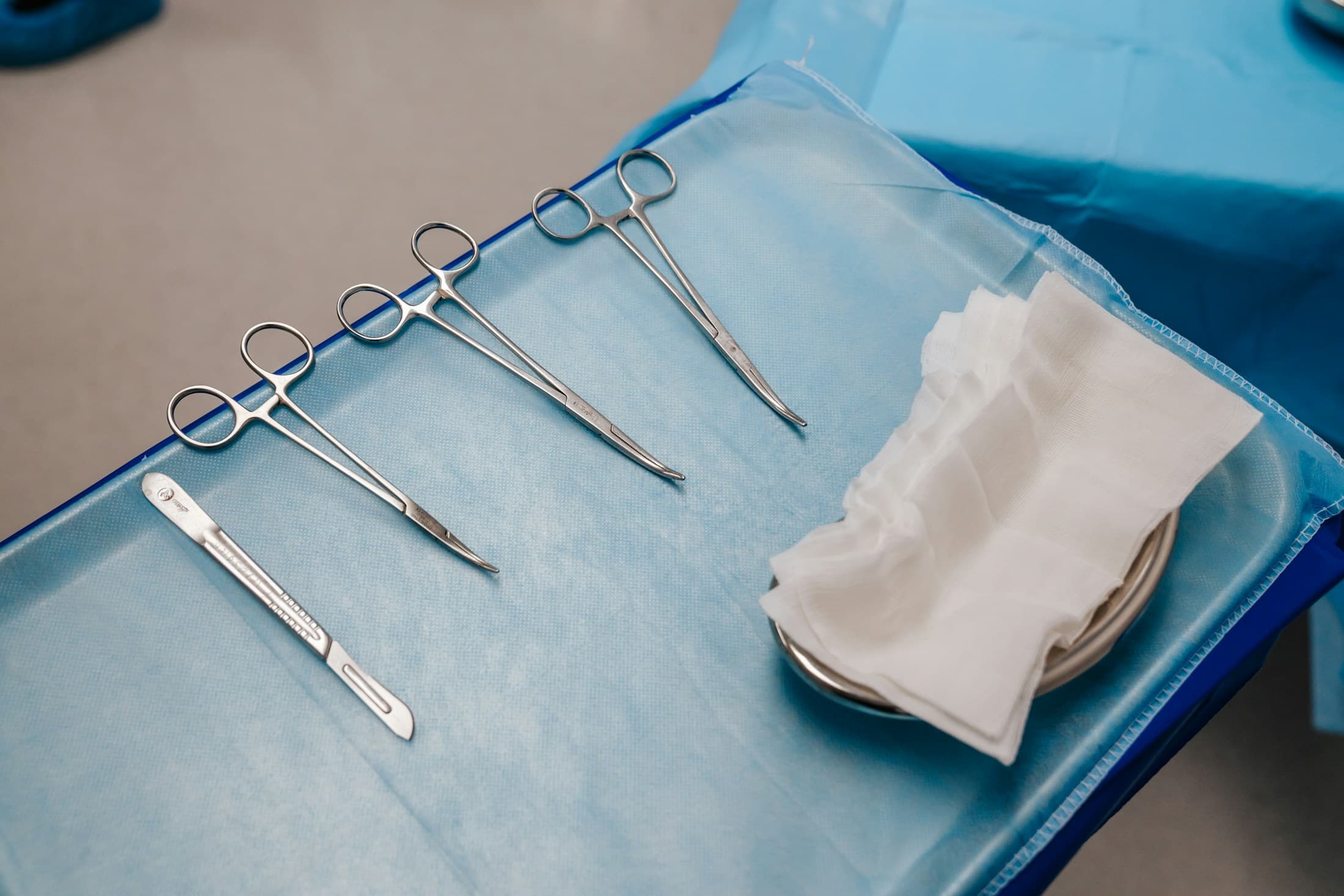 A sterile instrument set laid out on a drape before surgery