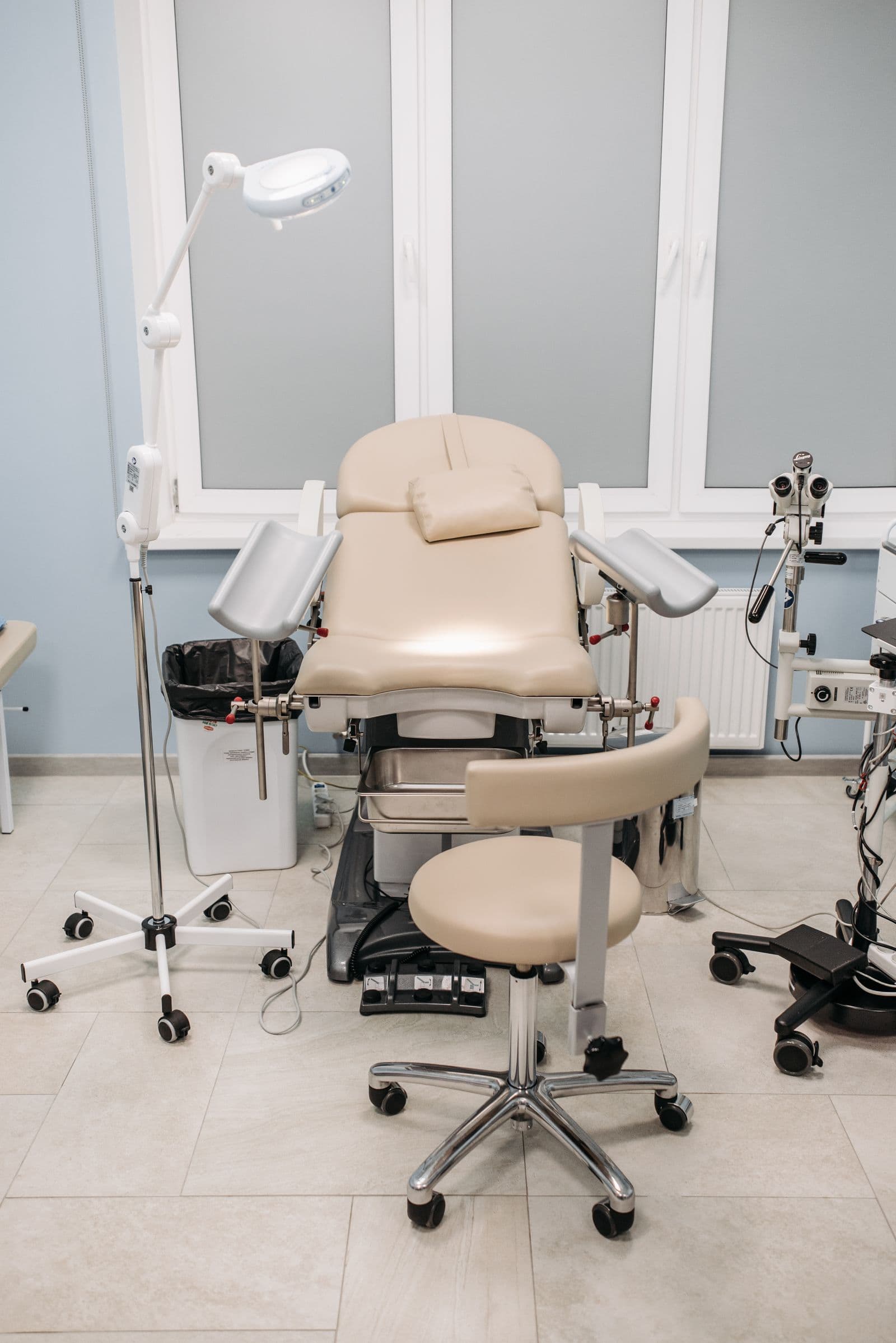 A well-equipped gynaecological examination room with modern medical equipment